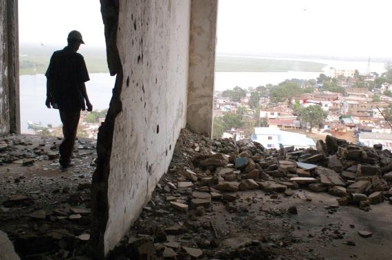 A figure stands in the ruined E.J. Roye Building in Monrovia, Liberia, in 2012. All photos courtesy Danny Hoffman.