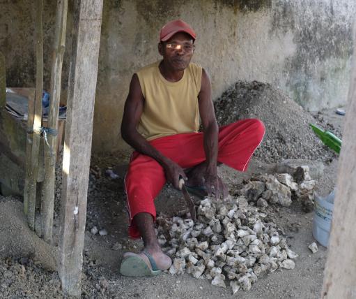  Edison Laikaran, friend of the author, breaks coral in the Marbali neighborhood of Dobo.