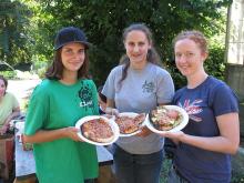 Three ANTH 361 students with pizza slices