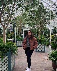 Graduate student Rachael Tamngin standing in botanical garden