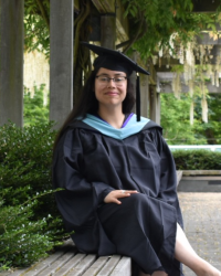 Color photograph of Kendall Vinyard in graduation cap and gown.