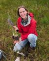 Elizabeth holding a bunch of purple camas plants