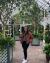 Graduate student Rachael Tamngin standing in botanical garden
