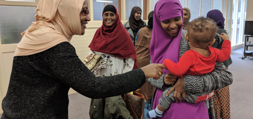 Faisa Farole, midwife, doula and Director, Funder of Somali Doulas Northwest, with participants of the community birth education training for doulas at Parent Trust, Seattle