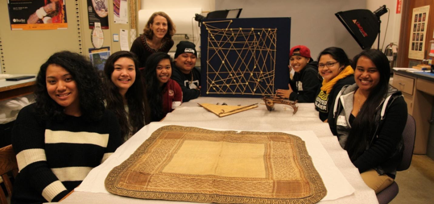 Research Family students in the old Burke surrounded by cultural artifacts